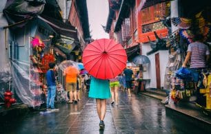 Girl in Chinese Market with Umbrella