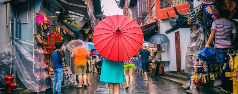 Girl in Chinese Market with Umbrella