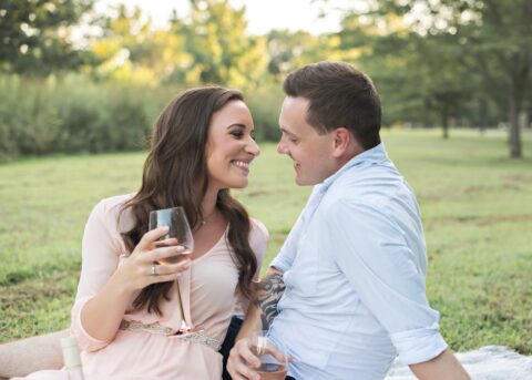 Couple smiling drinking wine