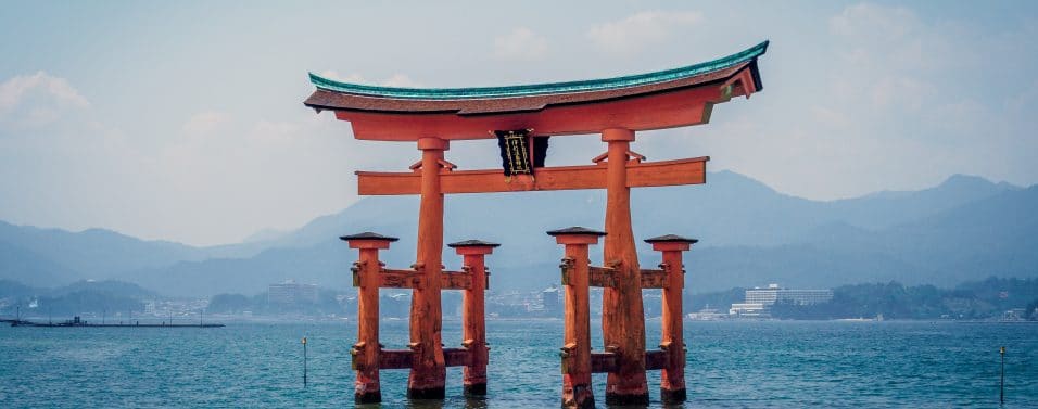 Red shrine in body of water