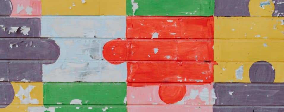 Puzzle pieces brightly painted on a wall