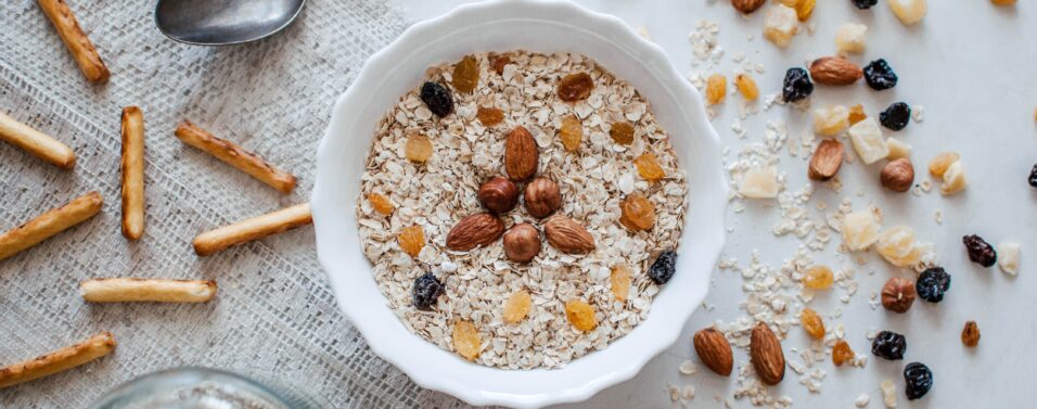 a bowl of nuts and granola and fruit