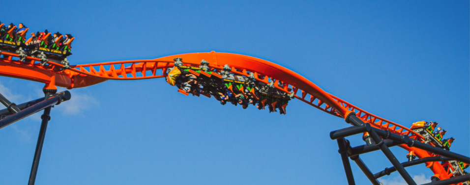 rollercoaster corkscrew with people screaming