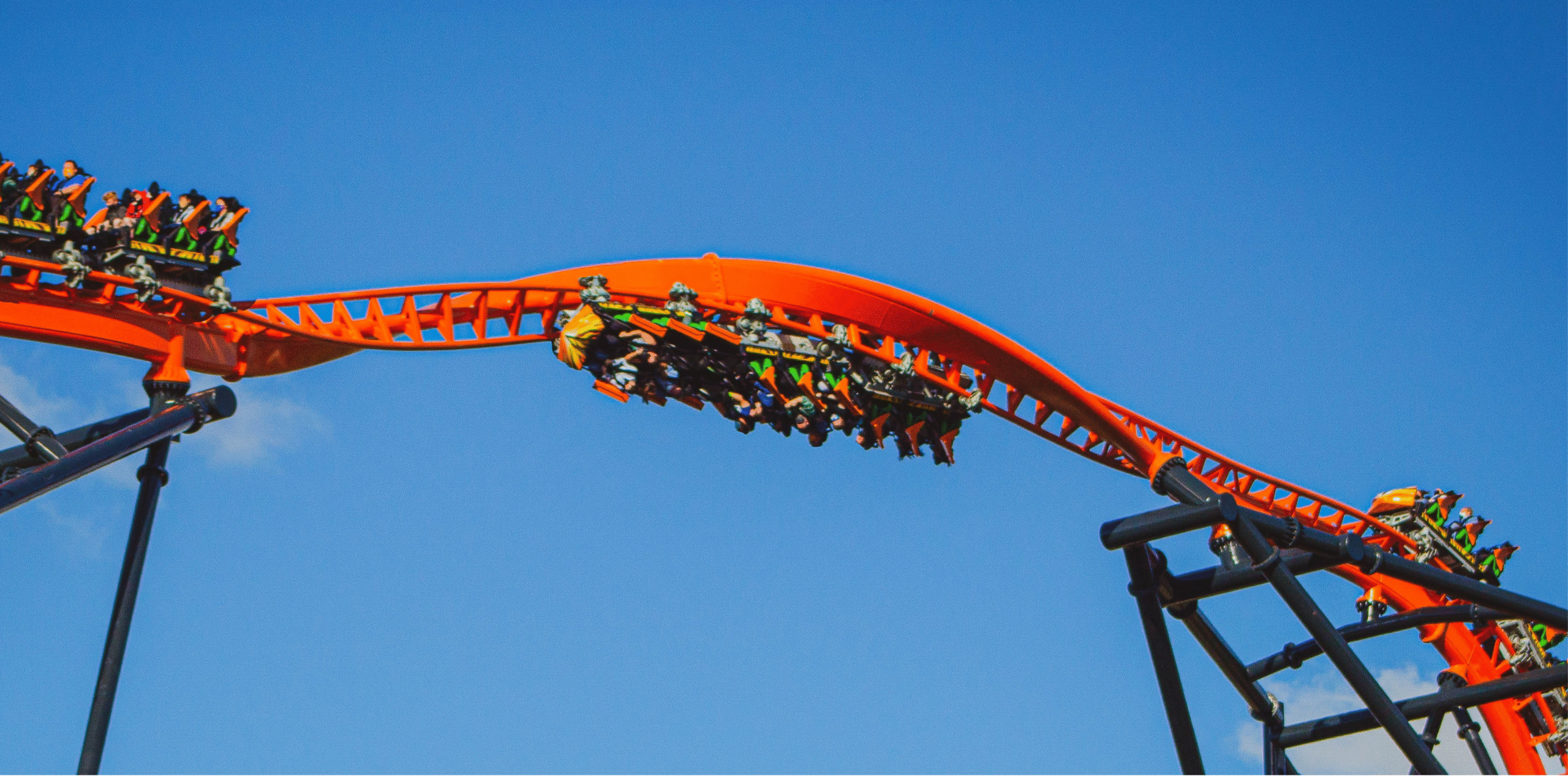 rollercoaster corkscrew with people screaming