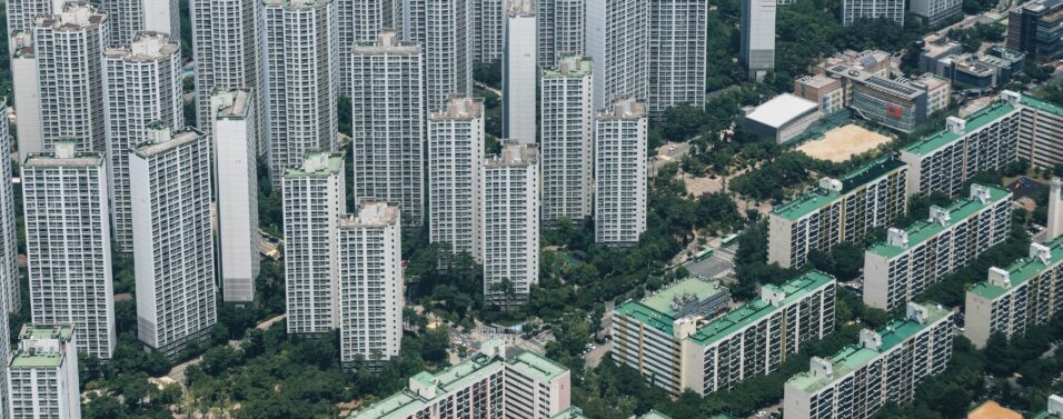 towering skyscraper properties next to lower properties