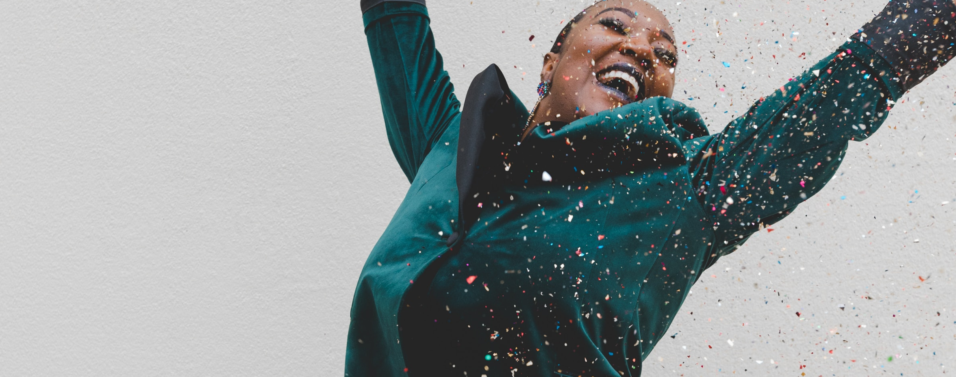 a woman celebrating the best mid-year funds