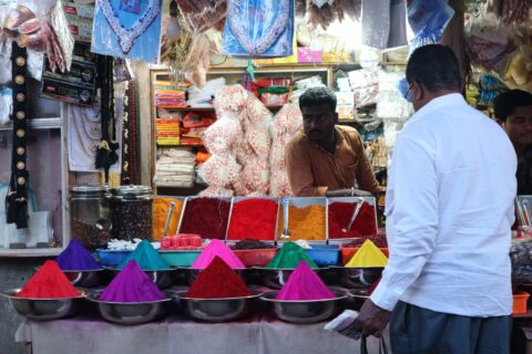 buying spices at an Indian market stall