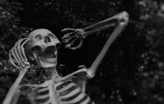 black and white skeleton screaming