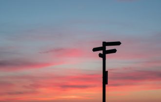 crossroads sign in the sunset